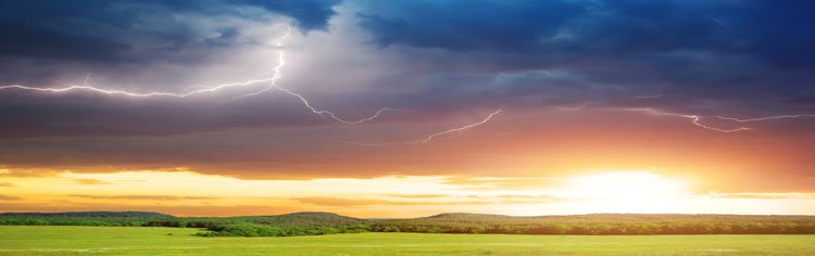 Lightning rainbow sunset over distant hills - All About Religion Banner